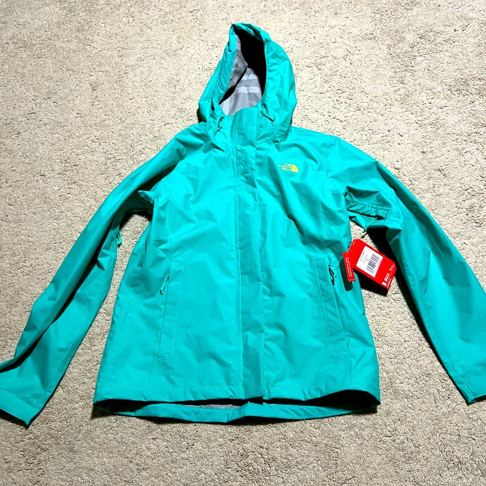Teal North Face rain jacket with hood. NWT size medium